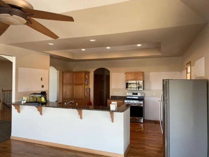 Original kitchen with outdated cabinets and layout before renovation