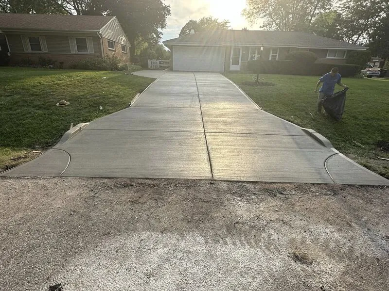 Completed new concrete driveway with broom finish at same brick ranch home